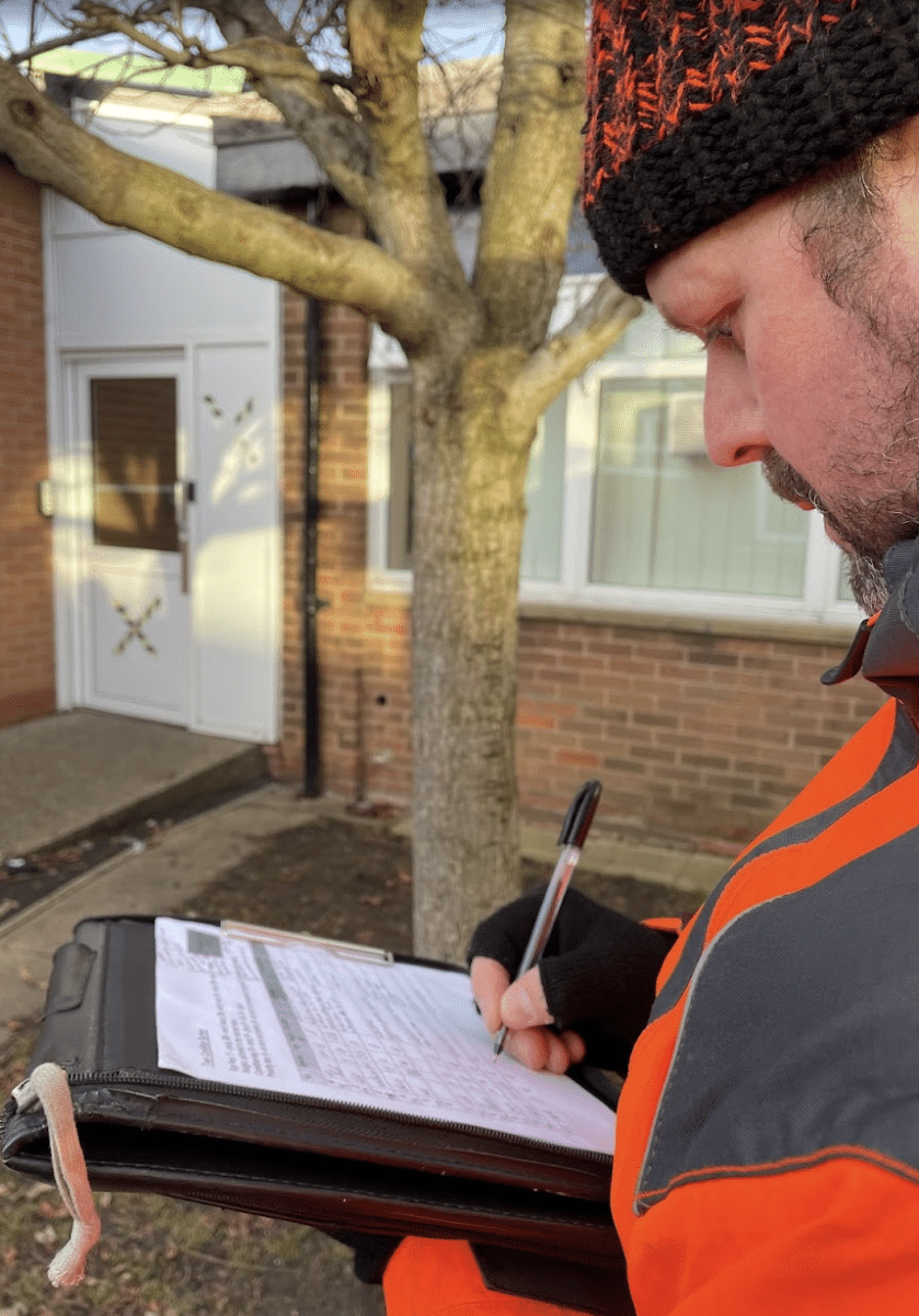 a tree surveyor recording information